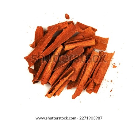 broken cinnamon sticks isolated on white background