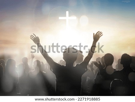Silhouette human raising hands to praying God on blurred cross  background Royalty-Free Stock Photo #2271918885
