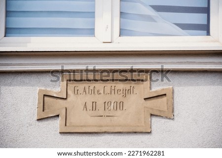 Old inscriptions carved stone on the facade of a house G. Abt and C. Heydt A.D 1900