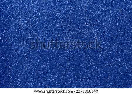 Abstract background filled with shiny dark blue glitter