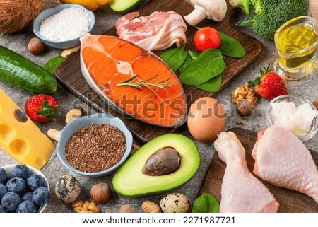 Healthy balanced diet food. Keto, low carb, atkins diet concept. Fish, meat, fruits vegetables, berries, mushroom and nuts Royalty-Free Stock Photo #2271987721