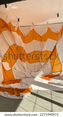 Photo studio with orange parachute