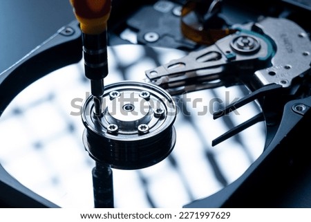 the technician repairing inside of hard disk