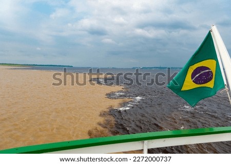 nature waterscape of river with brazil flag. nature waterscape as travel destination. Royalty-Free Stock Photo #2272000737