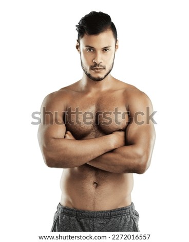 Getting stronger with each workout. Studio portrait of an athletic young man posing against a white background.