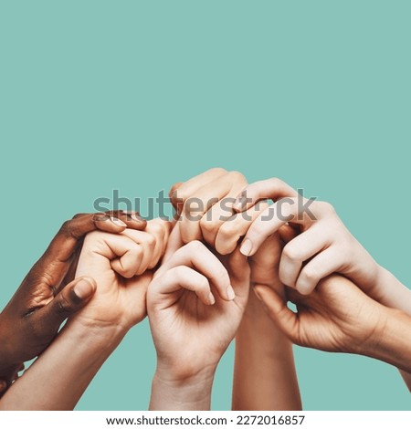 Praying, hands and people united in prayer, worship or community encouragement in studio. Diversity, pray and worship by group in church for praise, help or hope, blessing and God on green background Royalty-Free Stock Photo #2272016857