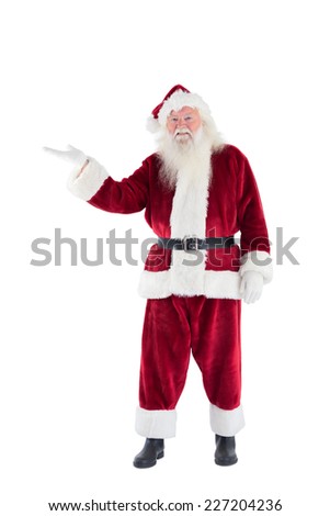 Santa shows something to camera on white background