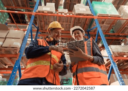 The Manager delivers the report to the foreman and jointly inspects the goods that need to be brought into the central warehouse. Before sending to each regional distribution center. Royalty-Free Stock Photo #2272042587
