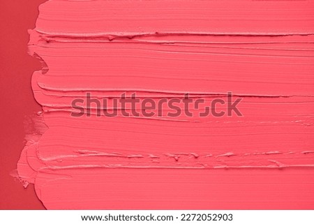 Lipstick or creamy blusher abstract strokes smudges  background texture multi colored red blush coral background