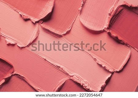 Lipstick or creamy blusher abstract strokes smudges  background texture multi colored red blush background