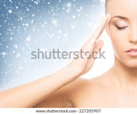 Spa portrait of young and beautiful woman over winter Christmas background 