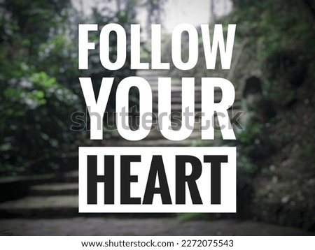 Motivational quote "Follow your heart" on blurred nature background.