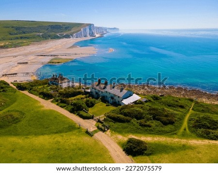 Coastguard Cottages from an aerial point of view with Seven Sisters Country Park in the background  

 Royalty-Free Stock Photo #2272075579