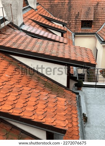 roof, closeup roof tile of house or homes with chimney and dormer window. building exterior concept photo. building background or surface with tiled roof with selective focus and noise effects