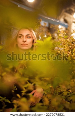 Portrait of beautiful woman in the evening with city light