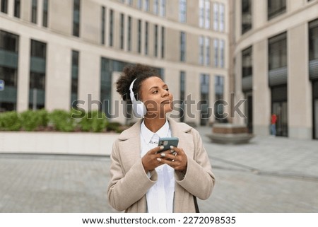 african young woman student during break from study enjoy weather and music