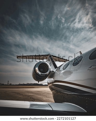 A small private jet coming in from a long flight. Royalty-Free Stock Photo #2272101127