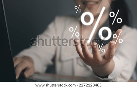 Concept of financial interest rates and dividends provision of financial services.Businesswoman showing percentage icons and up arrow icons. Interest Rates Stocks Finance Ratings Mortgage Rates.