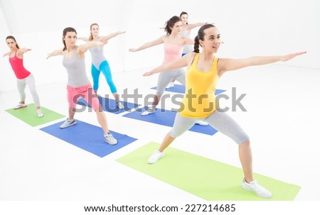 Young women doing exercise in a studio.