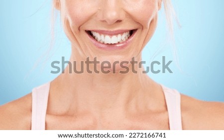Smile, teeth whitening and woman mouth in studio, blue background and facial wellness. Closeup female model, clean dental and happy face of fresh breath, tooth implant and healthy aesthetic beauty Royalty-Free Stock Photo #2272166741