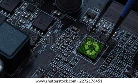 Green technology concept, recycling sign on circuit board technology innovation and IT ethics. Earth's green nature or new system technology
