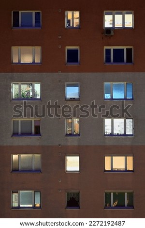 Apartment block windows at night Royalty-Free Stock Photo #2272192487