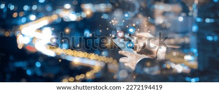 Banner of social media interactions and internet digital marketing concept, Mobile phone with notification icons of like, message, email, comment above smartphone screen, person hands holding device