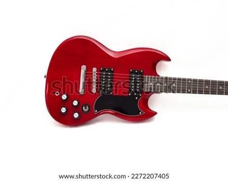 Red electric guitar isolated on white background. Musical instrument guitar. Close-up. Royalty-Free Stock Photo #2272207405