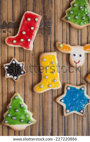 Christmas homemade colorful cookies on wooden table