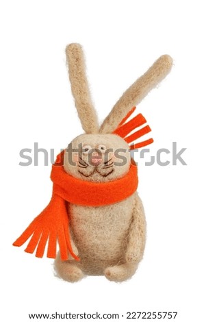 handmade stuffed toy, rabbit with orange scarf isolated