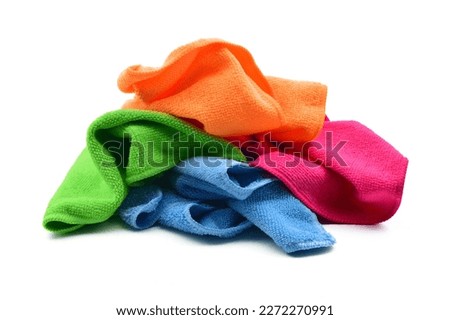 Four colors microfiber cleaning cloths, crumpled and isolated on white background