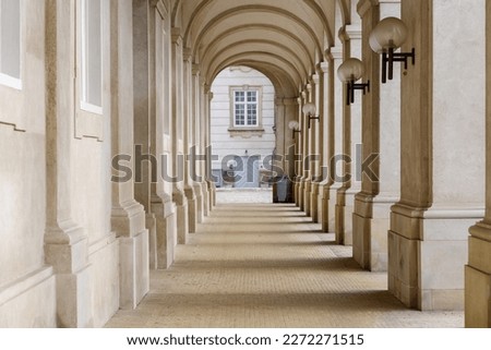 Diminishing perspective view between outdoor arch corridor of  Christiansborg Palace in Copenhagen, Denmark. Royalty-Free Stock Photo #2272271515