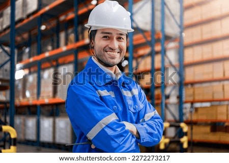 smart man worker wearing working suite dress and safety helmet at cargo for stack item for shipping.female worker checking the store factory. industry factory warehouse. Inspection quality control. Royalty-Free Stock Photo #2272273217