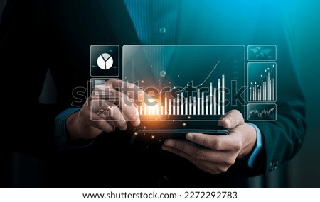 Businessman analyzing business enterprise data management, Business analytics with charts, metrics and KPIs to performance organization. Corporate strategy for finance, operations, sales, marketing Royalty-Free Stock Photo #2272292783