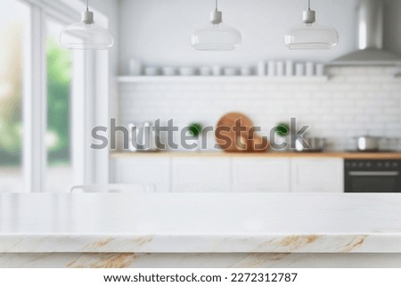 Wood table top on blurred kitchen background. can be used mock up for montage products display or design layout	