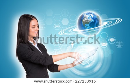 Beautiful businesswomen in suit using digital tablet. Earth and hexagons with icons. Element of this image furnished by NASA