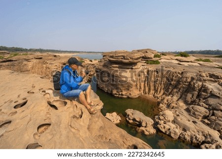Tourists take pictures and visit Chom Dao Beach or Grand Canyon in Ubon Ratchathani, Thailand.