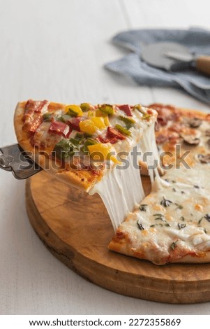 Top view of mix pizza with mozzarella cheese, sausage and kind of vegetables