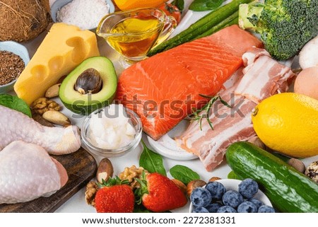 Keto diet concept. Ketogenic diet food. Balanced low carb food background. Vegetables, fish, meat, cheese, nuts. Atkins diet Royalty-Free Stock Photo #2272381331