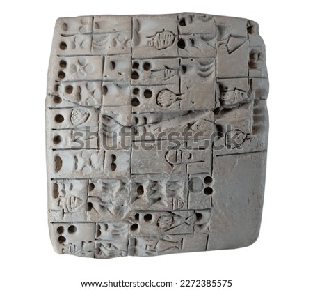 Cuneiform tablet isolated on white Royalty-Free Stock Photo #2272385575
