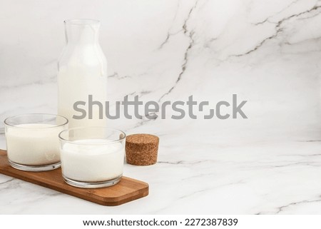 lactose free yogurt, kefir, fermented milk on a light background. Healthy, clean eating. Vegan or gluten free diet, Royalty-Free Stock Photo #2272387839