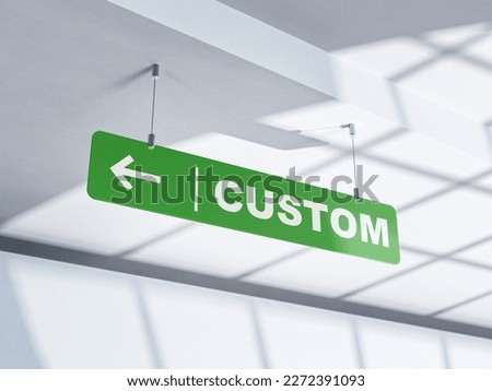 Custom, a green sign and an arrow indicating the direction. Customs area.
