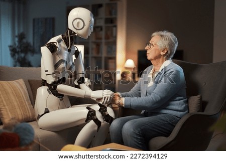 An elderly woman confides her psychological distress to her robotic assistant. Concept of psychological support thanks to A.I. Royalty-Free Stock Photo #2272394129