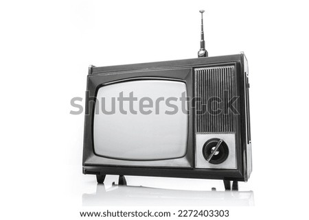 Retro analog portable black and white  TV set with antena. Right side view on a white background.