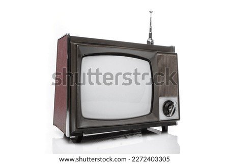 Retro analog portable black and white  TV set with antena. Left side view on a white background.