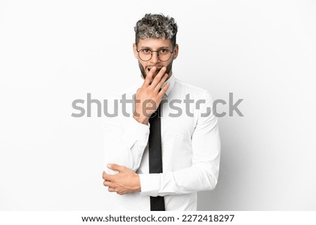 Business caucasian man isolated on white background surprised and shocked while looking right
