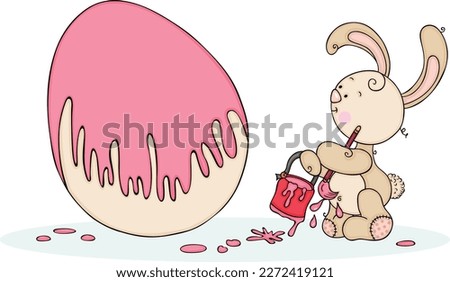 Little bunny painting big easter egg
