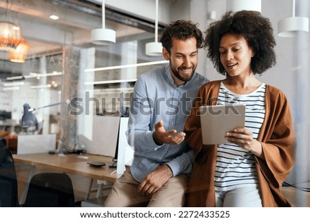 Group of designers, business people at work in corporate office. Startup, happy teamwork concept. Royalty-Free Stock Photo #2272433525
