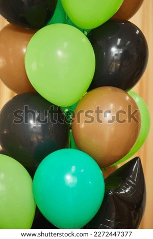 Balloons of different colors filled with helium as a decoration on a children's holiday or birthday.