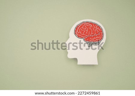 A brain shape symbol on a green background. Awareness of Alzheimer's, Parkinson's, dementia, stroke, seizure, or mental health. Medical and Healthcare concept Royalty-Free Stock Photo #2272459861